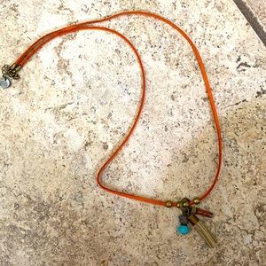 Orange leather adjustable necklace with roxk and leather dangle pendent